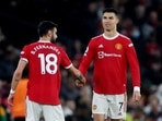 Bruno Fernandes (L) with Cristiano Ronaldo
