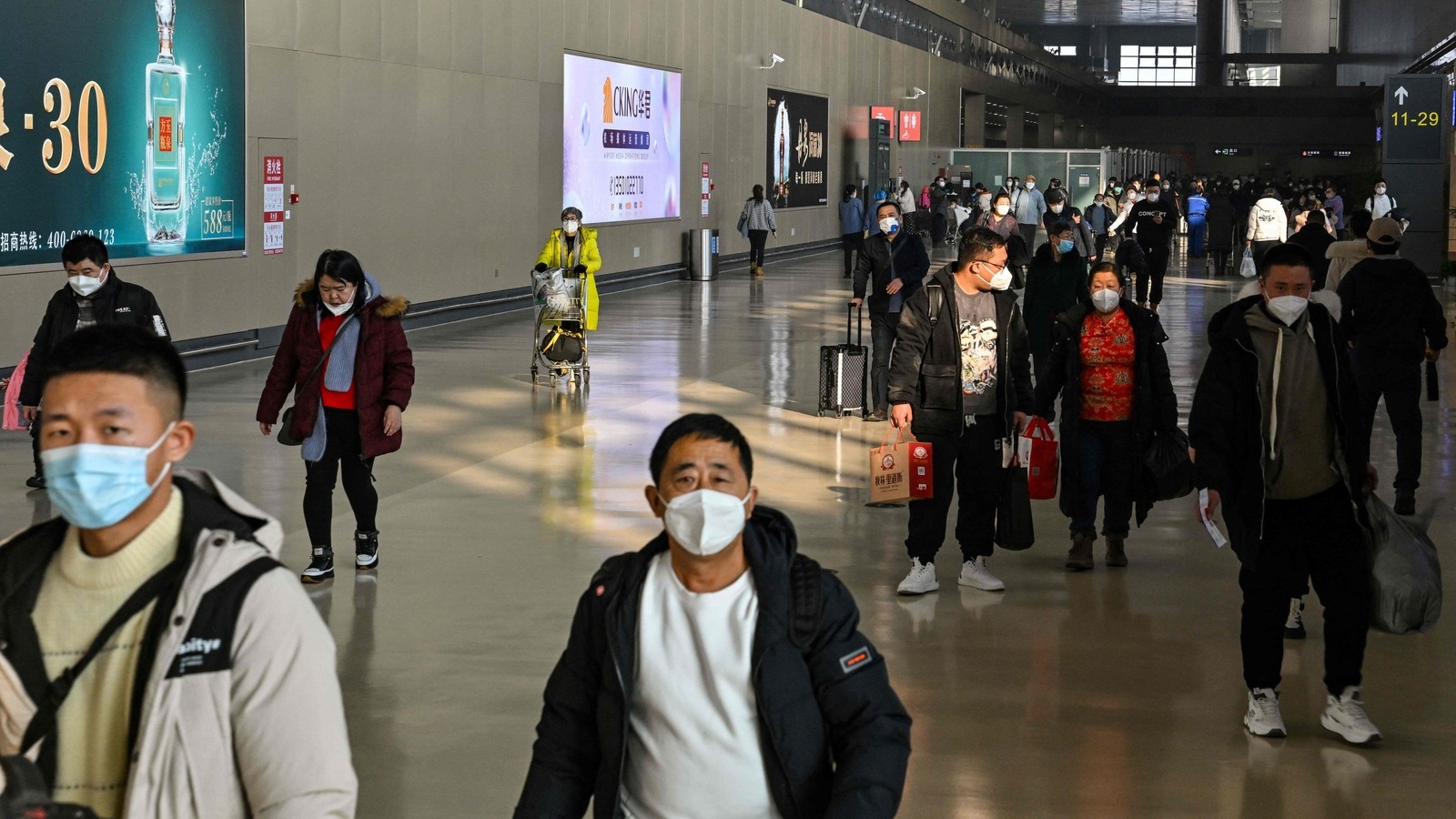 China ends quarantine for overseas travellers amid Covid surge World