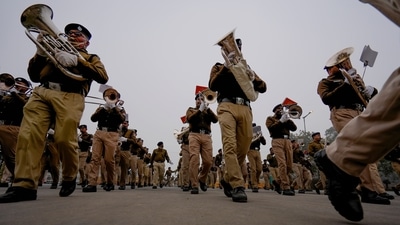 A marching band contingent of the Railway Protection Force (RPF) is seen rehearsing for the 74th Republic Day Parade near Rashtrapati Bhawan on a cold morning. On January 5, Delhi logged a minimum temperature of three degrees Celsius -- the lowest in January in two years -- making it cooler than several hill stations, PTI reported. (Atul Yadav / PTI) A marching band contingent of the Railway Protection Force (RPF) is seen rehearsing for the 74th Republic Day Parade near Rashtrapati Bhawan on a cold morning. On January 5, Delhi logged a minimum temperature of three degrees Celsius -- the lowest in January in two years -- making it cooler than several hill stations, PTI reported. (Atul Yadav / PTI)