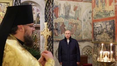 Vladimir Putin: Russian President Vladimir Putin attends the Orthodox Christmas service. (Reuters)