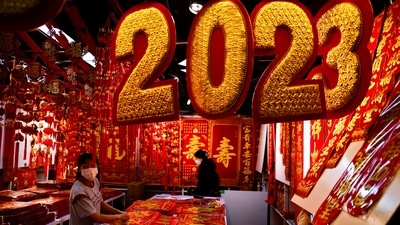 China Lunar Year: A vendor sorts decorations for Chinese Lunar New Year at a market. (Reuters)