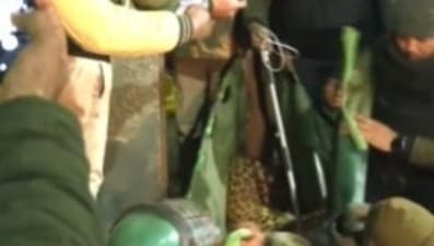 Officials seen carrying the big cat. (ANI) Officials seen carrying the big cat. (ANI)