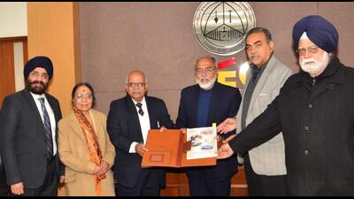 Members of the external peer review committee with Punjab Engineering College director Baldev Setia (in blue cardigan), in Chandigarh on Saturday. (HT Photo)