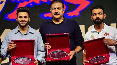 Indian cricketers Shardul Thakur (left), Ravi Shastri (former) and Ajinkya Rahane (right) are felicitated during the Mumbai Cricket Association (MCA) Annual Prize Distribution Function, at Sharad Pawar Cricket Academy Ground, in Mumbai, Friday, Jan. 6, 2023. (PTI) Indian cricketers Shardul Thakur (left), Ravi Shastri (former) and Ajinkya Rahane (right) are felicitated during the Mumbai Cricket Association (MCA) Annual Prize Distribution Function, at Sharad Pawar Cricket Academy Ground, in Mumbai, Friday, Jan. 6, 2023. (PTI)