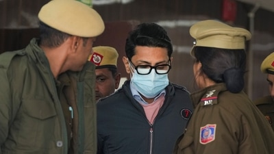 Shankar Mishra, accused of urinating on a woman passenger on an Air India flight from New York to Delhi, being taken away by the police from the DCP office at IGI Airport in New Delhi on Saturday, (PTI) Shankar Mishra, accused of urinating on a woman passenger on an Air India flight from New York to Delhi, being taken away by the police from the DCP office at IGI Airport in New Delhi on Saturday, (PTI)
