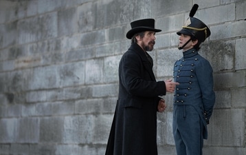 Actors Christian Bale and Harry Melling in a still from Netflix's The Pale Blue Eye. Actors Christian Bale and Harry Melling in a still from Netflix's The Pale Blue Eye.