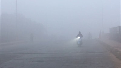 A vehicle plies through dense fog on a cold winter day. (ANI/ Representational Image) A vehicle plies through dense fog on a cold winter day. (ANI/ Representational Image)