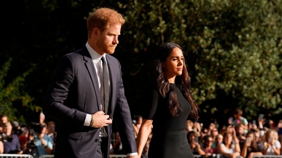 Prince Harry Memoir Spare Leaked: Meghan Markle, Duchess of Sussex and Prince Harry are seen.(AP)