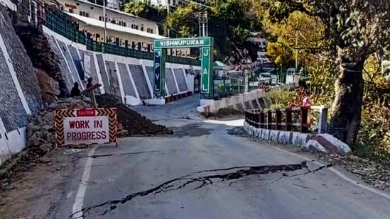 Cracks appear in the houses and on the roads due to landslides at the Joshimath of Chamoli district of Uttarakhand. (PTI)