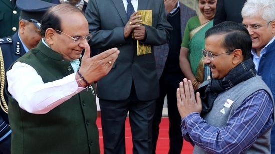 Delhi lieutenant governor Vinai Kumar Saxena being greeted by AAP convenor and Delhi chief minister Arvind Kejriwal at an event at Raj Nivas in New Delhi.(ANI File photo)