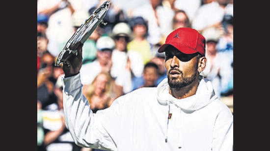 Nick Kyrgios of Australia wears a red cap on court during the trophy presentation at Wimbledon. “I do what I want,” he later said. (Getty Images)