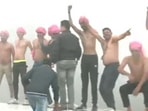 Congress supporters dance shirtless during Bharat Jodo amid biting cold.(ANI videograb) Congress supporters dance shirtless during Bharat Jodo amid biting cold.(ANI videograb)