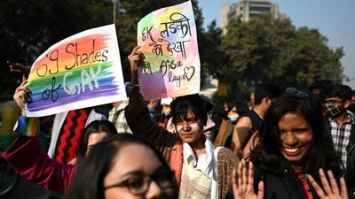 Pride walk supporters with placards promoting equal rights for the community members. (AFP) Pride walk supporters with placards promoting equal rights for the community members. (AFP)