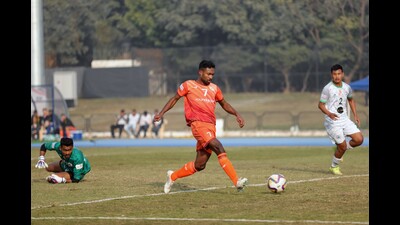 Players in action during the match between RoundGlass Punjab FC and NEROCA. (HT Photo)