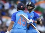India's Rohit Sharma, left, is congratulated by teammate Virat Kohli after scoring 50 runs (AP) India's Rohit Sharma, left, is congratulated by teammate Virat Kohli after scoring 50 runs (AP)