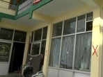 Joshimath: Red cross drawn outside a building to mark it as unsafe. (ANI) Joshimath: Red cross drawn outside a building to mark it as unsafe. (ANI)