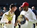  Serbia's Novak Djokovic poses with the trophy after winning the Wimbledon men's singles final alongside runner up Australia's Nick Kyrgios