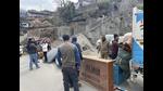 Residents load their belongings onto a truck to move to safer places, in Joshimath on Monday. (PTI) Residents load their belongings onto a truck to move to safer places, in Joshimath on Monday. (PTI)