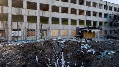 Russia-Ukraine War: Municipal workers clear the rubble on the roof of a college which was damaged by a Russian rocket attack in Kramatorsk, Ukraine. (AP) Russia-Ukraine War: Municipal workers clear the rubble on the roof of a college which was damaged by a Russian rocket attack in Kramatorsk, Ukraine. (AP)