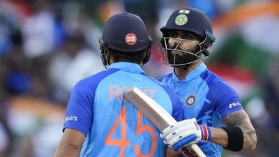 India's Rohit Sharma, left, is congratulated by teammate Virat Kohli after scoring 50 runs (AP)