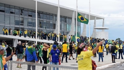 Supporters of Brazilian former President Jair Bolsonaro invade Planalto Presidential Palace in Brasilia. (AFP) Supporters of Brazilian former President Jair Bolsonaro invade Planalto Presidential Palace in Brasilia. (AFP)