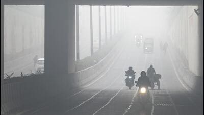 Commuters out on a foggy morning in Noida on Monday. (Sunil Ghosh/HT Photo) Commuters out on a foggy morning in Noida on Monday. (Sunil Ghosh/HT Photo)
