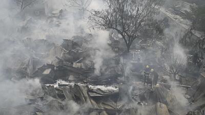 Gurugram, India-January 09, 2023: Firefighters are trying to control the fire in a slum area at sector 49 near Uppal Southend society; around 300 tin sheds are getting fired due to unknown reasons, and no one was injured in this fire incident, in Gurugram, India, on Monday, 09 January 2023. (Photo by Parveen Kumar/Hindustan Times) Gurugram, India-January 09, 2023: Firefighters are trying to control the fire in a slum area at sector 49 near Uppal Southend society; around 300 tin sheds are getting fired due to unknown reasons, and no one was injured in this fire incident, in Gurugram, India, on Monday, 09 January 2023. (Photo by Parveen Kumar/Hindustan Times)