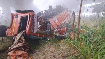 In the first accident, a canter truck loaded with tomatoes flipped over the guardrail of the flyover at zero point and plunged into a ditch at 5am. (HT Photo)