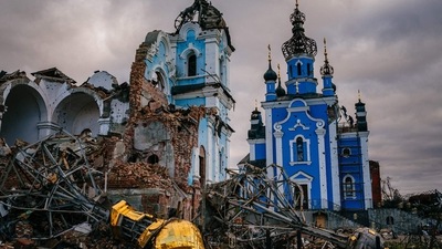 Russia-Ukraine War: Construction workers climb onto the roof of a destroyed church in the village of Bohorodychne, Donetsk region. (AFP)