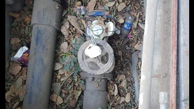 The officials from Chikhali tax collection department sealing the water connection near Aishwaryaum courtyard in Chikhali on Monday. (HT PHOTO)
