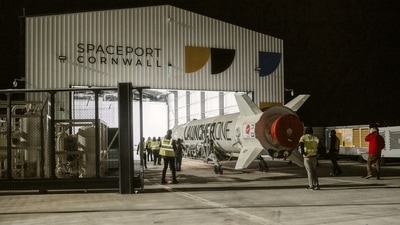 This undated photo provided by Virgin Orbit on Monday, January 9, 2023, shows the LauncherOne rocket in a hanger at Spaceport Cornwall, at Cornwall Airport in Newquay, England. (Virgin Orbit via AP) This undated photo provided by Virgin Orbit on Monday, January 9, 2023, shows the LauncherOne rocket in a hanger at Spaceport Cornwall, at Cornwall Airport in Newquay, England. (Virgin Orbit via AP)