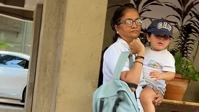 Jehangir Ali Khan was spotted with his nanny outside his house. The younger son of Kareena Kapoor and Saif Ali Khan looked cute in a white tee and grey shorts and also wore a black cap. (Varinder Chawla) 