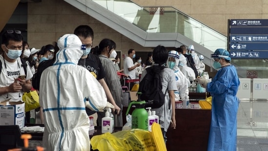 Nations tighten Covid restrictions as China reopens its borders, ending its Zero Covid policy almost after three years.(Bloomberg)