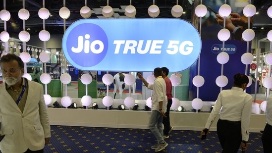 Visitors at the Reliance Jio Infocomm Ltd. booth at India Mobile Congress 2022 exhibition in New Delhi.(Bloomberg File)