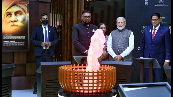 Prime Minister Narendra Modi at the first ever-digital Pravasi Bharatiya Divas Exhibition on the theme of ‘AzadiKaAmritMahotsav-Contribution of Diaspora in Indian Freedom Struggle’, in Indore on Monday. Guyana President Dr Mohamed Irfaan Ali and Suriname President Chandrikapersad Santokhi are also present. (ANI/PIB)