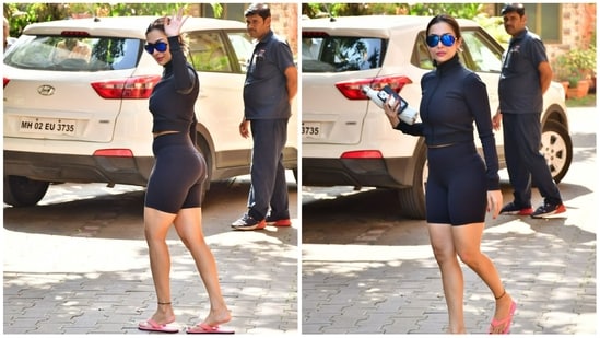 Malaika Arora was spotted at her yoga studio on Monday after returning to Mumbai on Sunday. She was seen in black gym wear and pink slippers. She recently made her web show debut with reality show Moving In With Malaika. (Varinder Chawla)