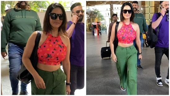 Sunny Leone was spotted at the Mumbai airport arrivals Monday afternoon. She was in a red floral top and green top. She is currently a host on dating reality show Splitsvilla X4 with Arjun Bijlani. (Varinder Chawla)