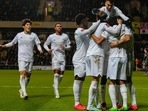 Arsenal players celebrate after their teammate Mohamed Elneny scored his side's first goal during the English FA Cup soccer match between Arsenal and Oxford United