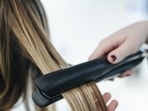 Heat-damaged hair can be caused by using styling tools such as hair dryers, straighteners, and curling irons, as well as chemical treatments like coloring and bleaching(Pexels) Heat-damaged hair can be caused by using styling tools such as hair dryers, straighteners, and curling irons, as well as chemical treatments like coloring and bleaching(Pexels)