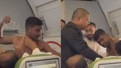 The shirtless man fighting with another passenger on flight. (source:Twitter/@Bitanko_Biswas) The shirtless man fighting with another passenger on flight. (source:Twitter/@Bitanko_Biswas)