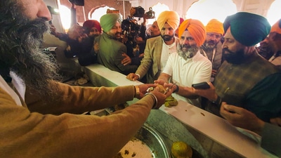 In this picture, Rahul Gandhi can be seen collecting 'prasad' at the Golden temple in Amritsar. (PTI) In this picture, Rahul Gandhi can be seen collecting 'prasad' at the Golden temple in Amritsar. (PTI)