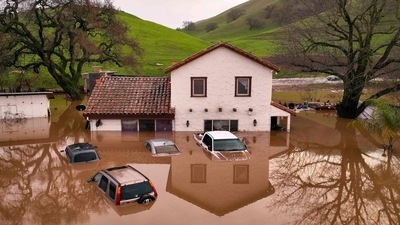A flooded house is seen partially underwater in Gilroy, California. (AFP)