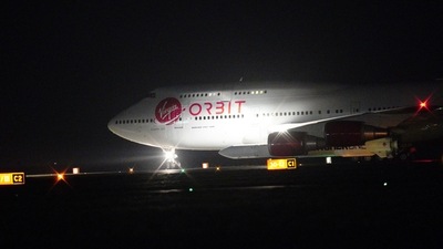 A repurposed Virgin Atlantic Boeing 747 aircraft, named Cosmic Girl, carrying Virgin Orbit's LauncherOne rocket, taxis down the runway ahead of take off at Spaceport Cornwall at at Cornwall Airport, Newquay, England. (AP) A repurposed Virgin Atlantic Boeing 747 aircraft, named Cosmic Girl, carrying Virgin Orbit's LauncherOne rocket, taxis down the runway ahead of take off at Spaceport Cornwall at at Cornwall Airport, Newquay, England. (AP)