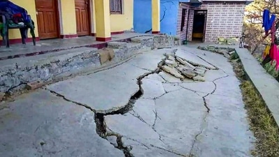 Cracks appear at a house due to landslides at Joshimath in Chamoli district of Uttarakhand. (PTI)