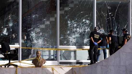 Damage outside the Supreme Federal Court building following protests Bolsonaro's supporters in Brasilia, on January 9. “We are not going to allow democracy to slip out of our hands,” Lula said at an official meeting, according to Bloomberg. “They want a coup, and there won’t be a coup.” (Amanda Perobelli / Reuters)