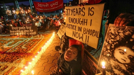 Children born with congenital disabilities, believed to have been caused by the exposure of their parents to gas leakage in the 1984 Bhopal gas tragedy, along with supporters take part in a candlelight vigil to pay homage to those killed in the disaster, in Bhopal.(PTI)