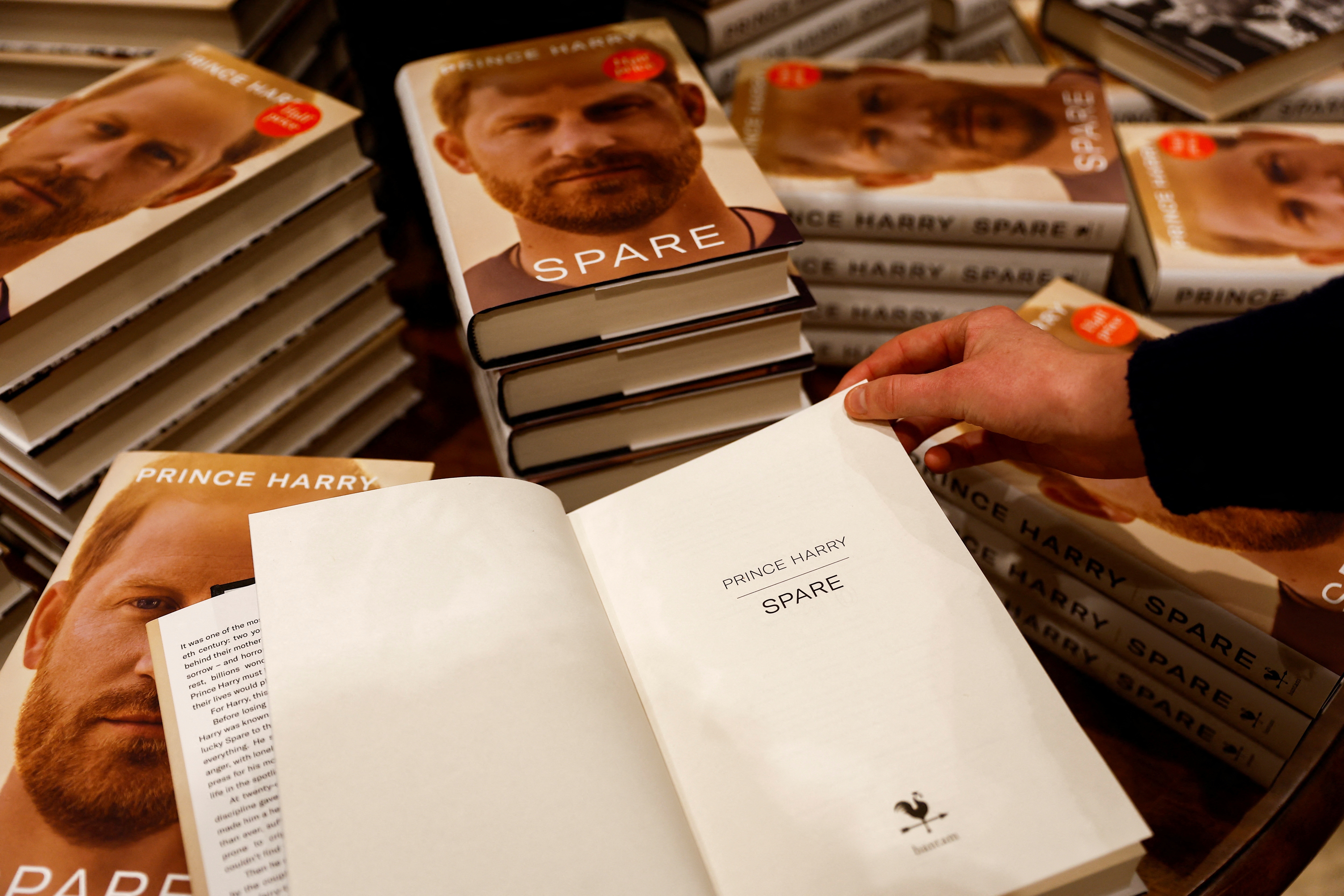 A person looks at a copy of Britain's Prince Harry's autobiography 'Spare'. (Reuters)