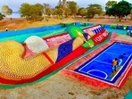 Odisha: Sand artist Sudarsan Pattnaik creates a '105 feet Hockey stick with 5000 Hockey ball' sand sculpture near Barabati Stadium in Mahanadi, Cuttack, Tuesday.(PTI) Odisha: Sand artist Sudarsan Pattnaik creates a '105 feet Hockey stick with 5000 Hockey ball' sand sculpture near Barabati Stadium in Mahanadi, Cuttack, Tuesday.(PTI)
