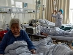 Elderly patients with Covid-19 symptoms receive intravenous drips at the emergency ward of a hospital in Fuyang in central China's Anhui province. (AP/PTI) Elderly patients with Covid-19 symptoms receive intravenous drips at the emergency ward of a hospital in Fuyang in central China's Anhui province. (AP/PTI)