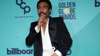 Donald Glover was practically in PJs. He wore a comfy robe shirt which he paired with relaxed white trousers. The look was Saint Laurent. (Invision/AP)
